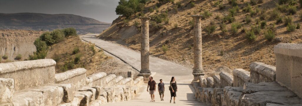 tourists walking in desert ruins